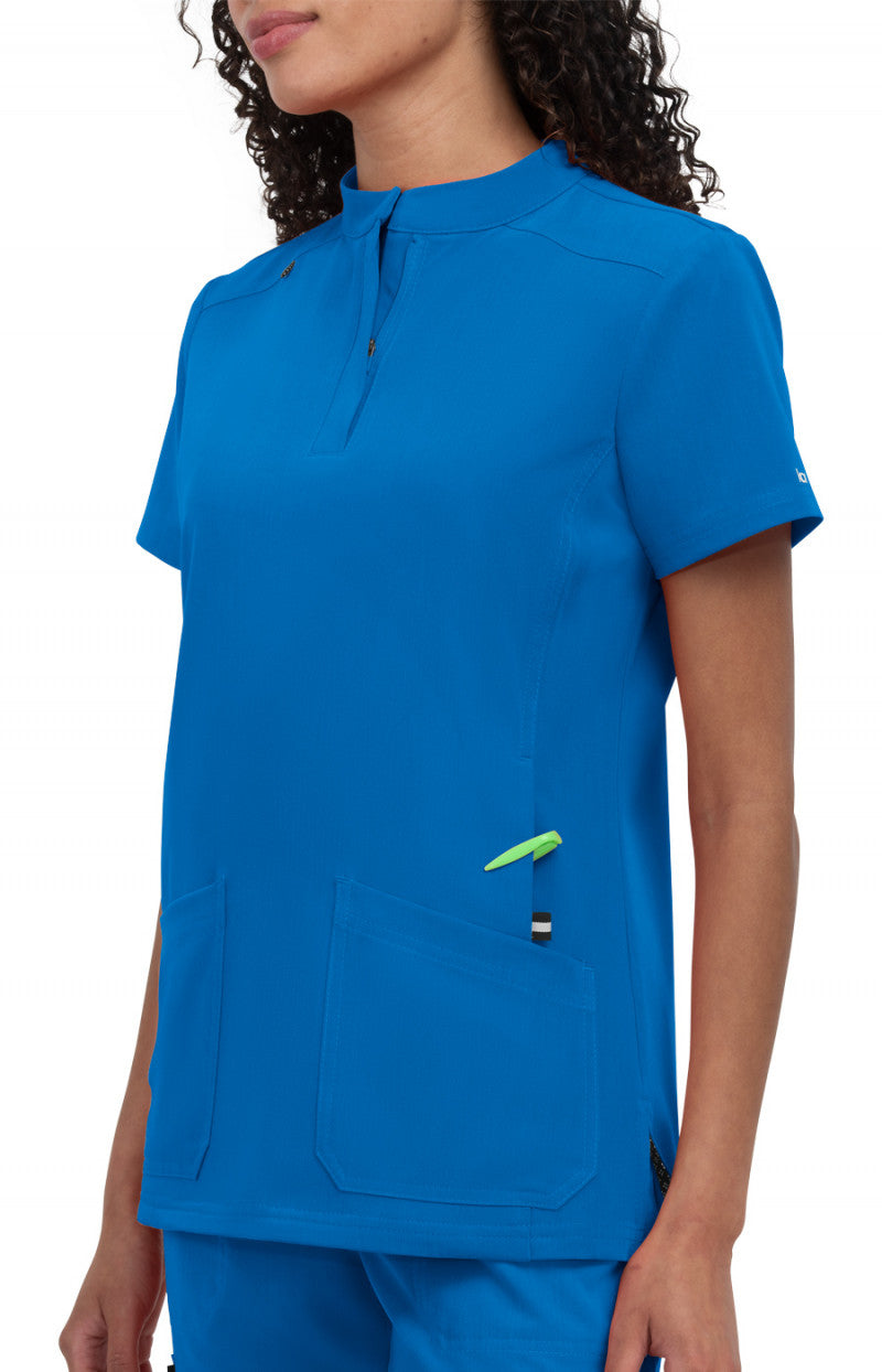 koi Next Gen Driven Women's Top