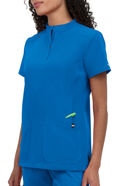 koi Next Gen Driven Women's Top